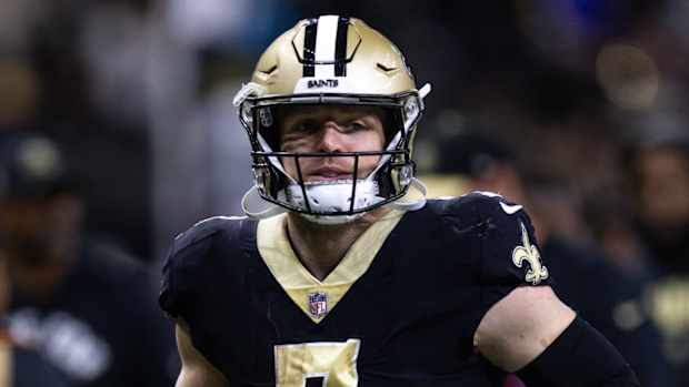 Saints tight end Taysom Hill runs off the field.